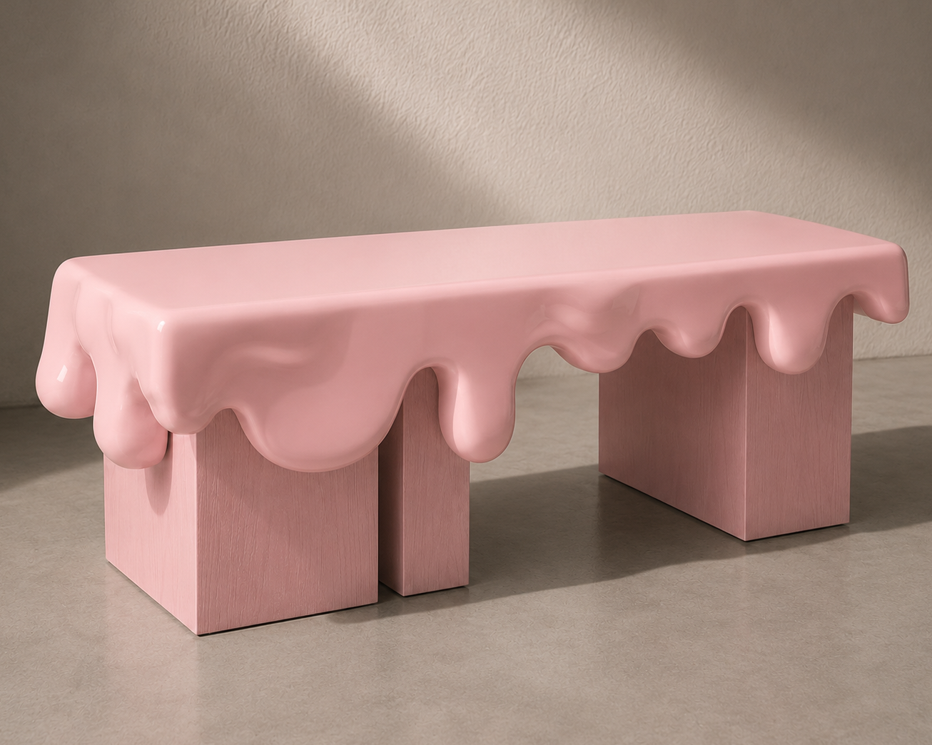 A pink sculptural bench with a glossy dripping wax or chocolate effect, set against a neutral concrete and plaster wall background.